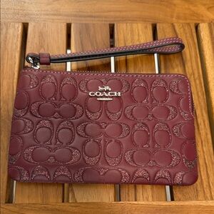 Coach Embossed Maroon Wristlet